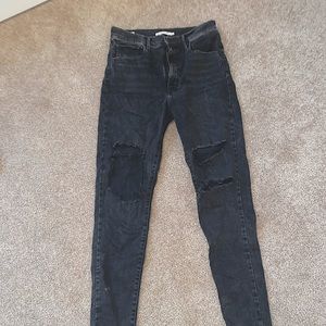 Never worn black skinny jeans with knee rips